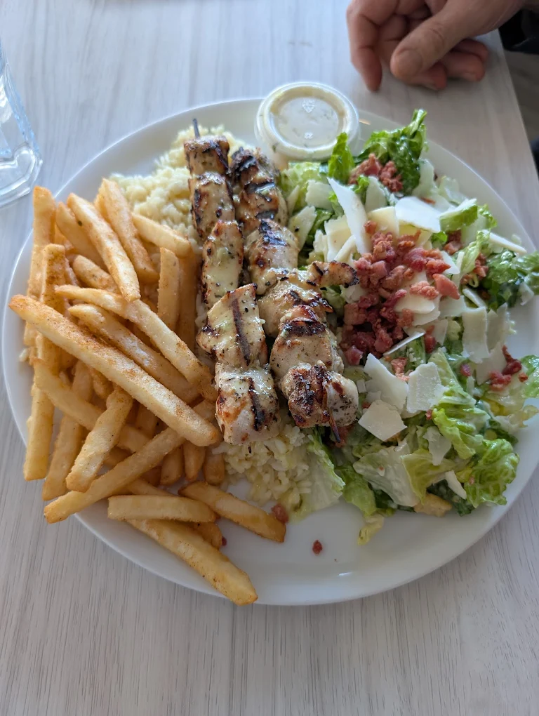Grilled salmon with shrimp, rice and potatoes