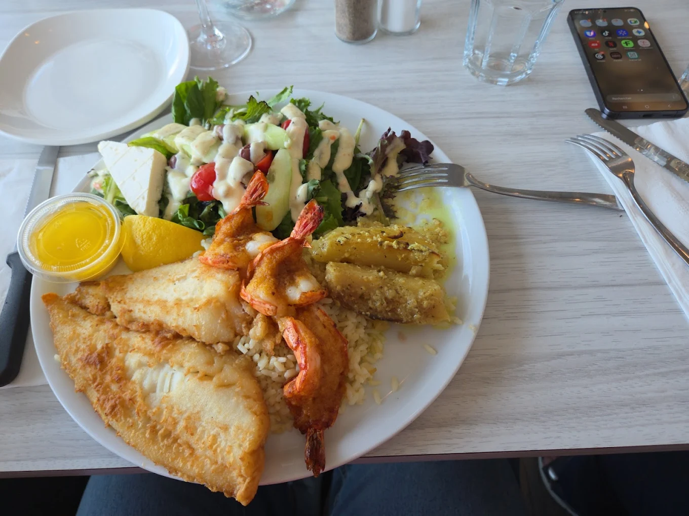Chicken skewer with fries, rice and Caesar salad